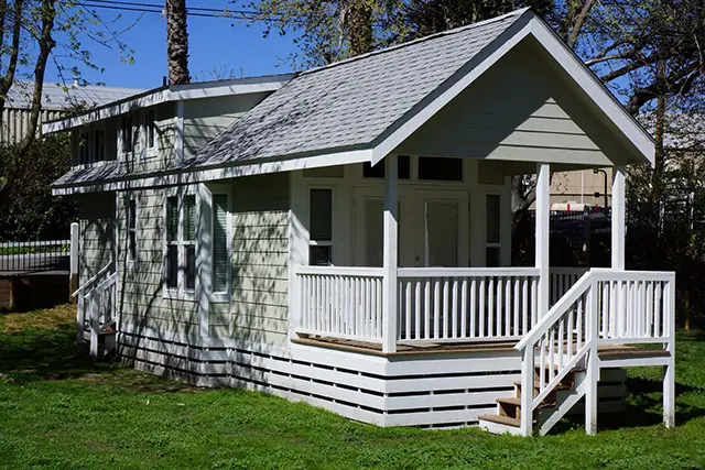 Park model home with a covered front porch