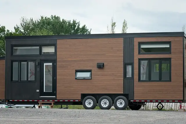 Tiny home on wheels on a triple-axle trailer